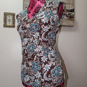 Stretchy Brown Sleeveless Blouse With Blue And White Floral Print